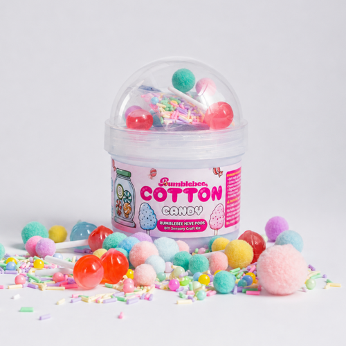 Cotton Candy butter slime Hivepod with pastel pom-poms, beads and sprinkles scattered around it