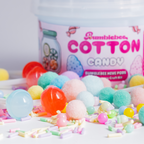 Close-up of the Cotton Candy Hivepod label with pastel pom-poms and candy beads in the foreground
