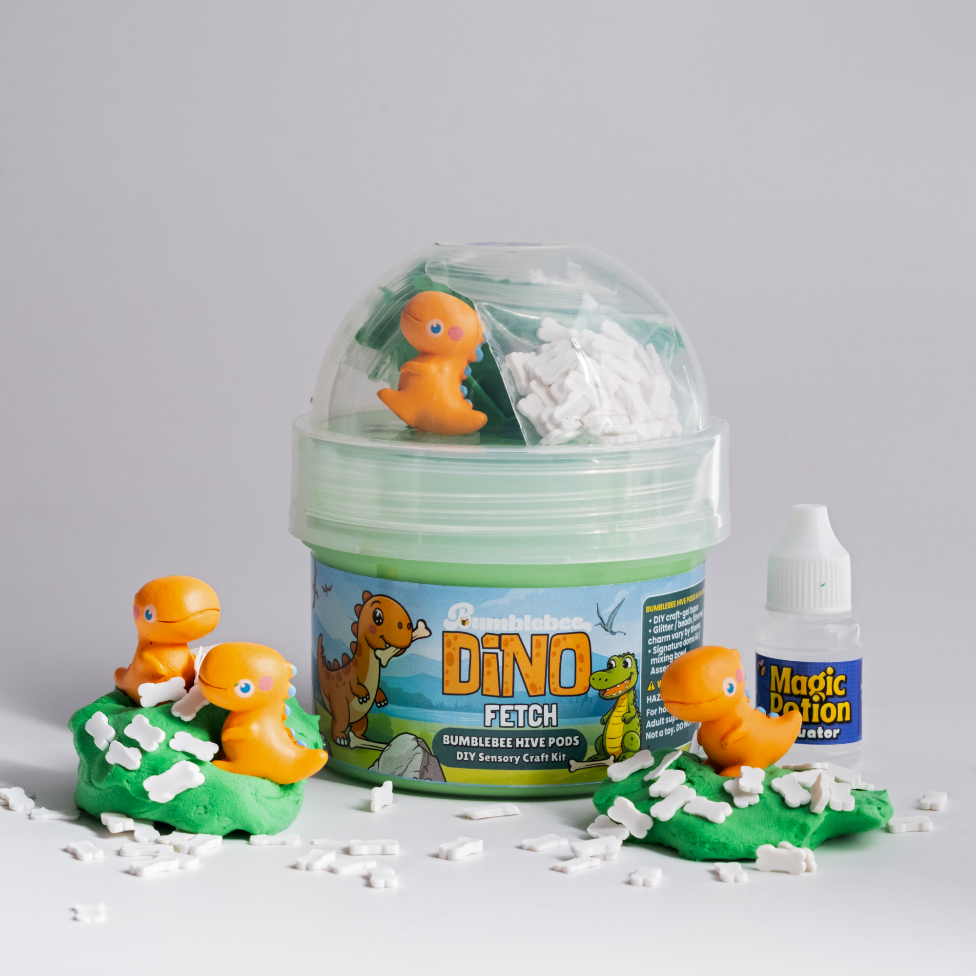 Dino Fetch Hivepod with orange dinosaur charms and bone-shaped sprinkles scattered around it