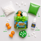 Dino Fetch contents laid out: bone sprinkles, dinosaur charms, green clay, activator bottle and slime