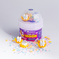 Over the Moon Hivepod with bunny-on-the-moon charms and pastel sprinkles scattered around it