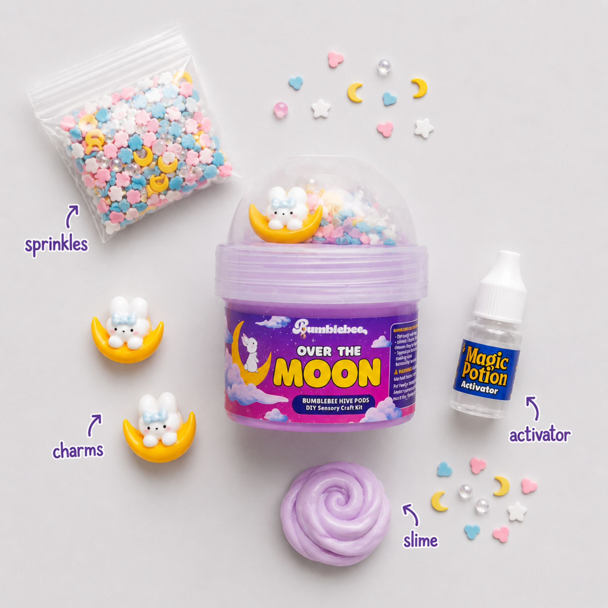 Over the Moon contents laid out: pastel sprinkles, bunny moon charms, activator bottle and lilac slime