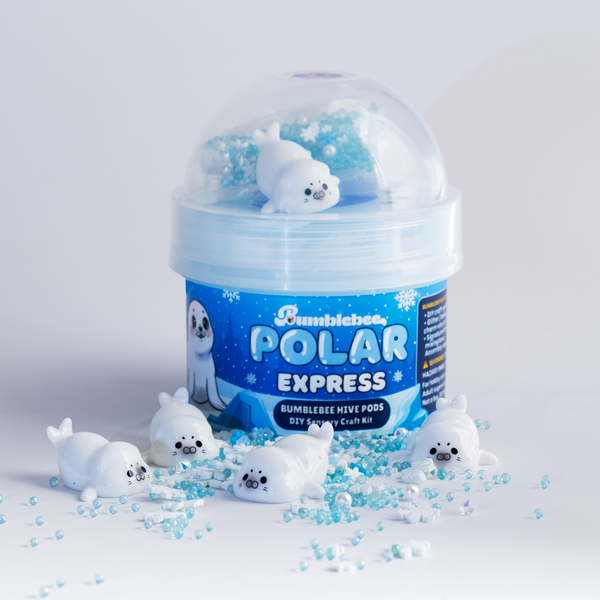 Polar Express Hivepod with baby seal charms and blue pearl beads scattered around it