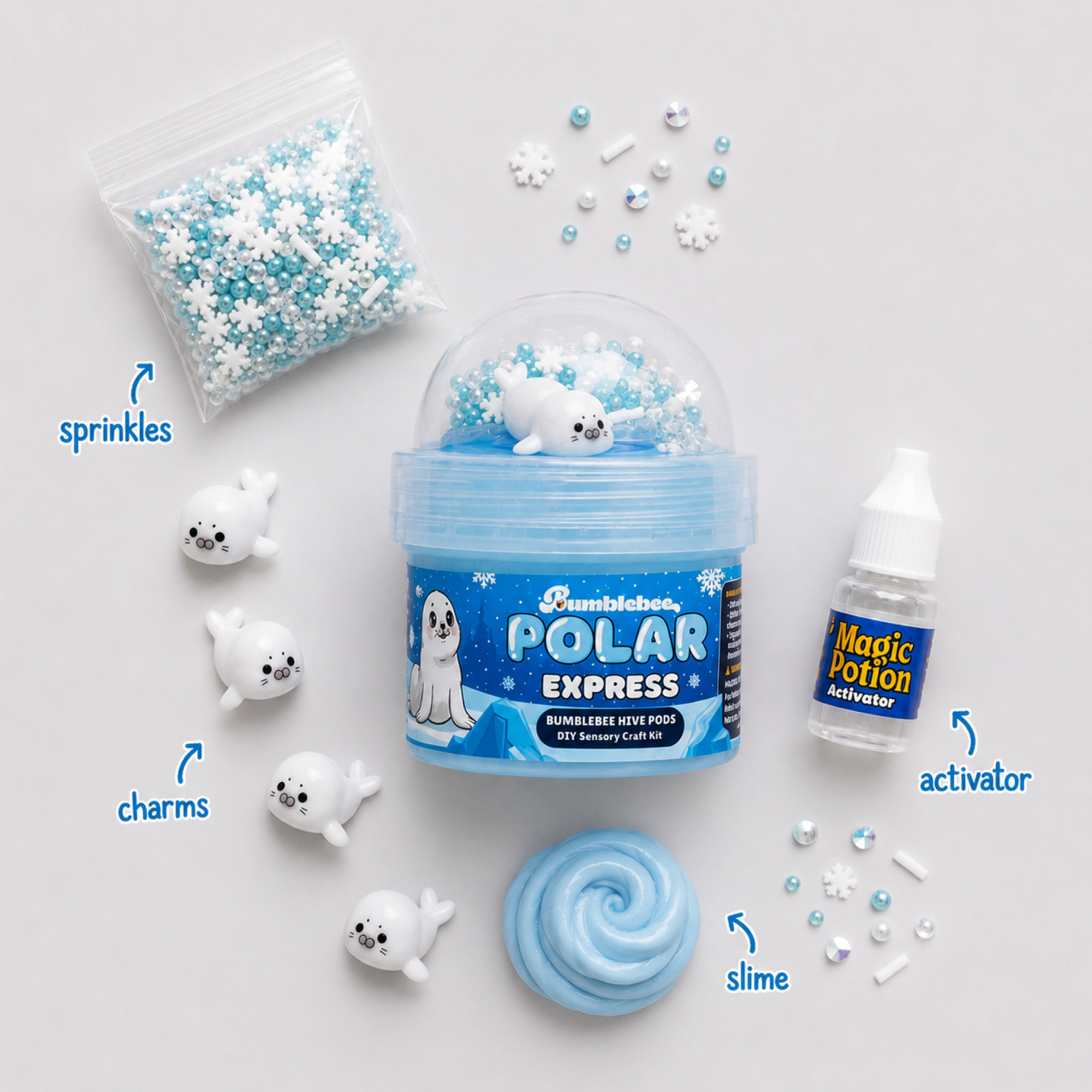 Polar Express contents laid out: snowflake and pearl sprinkles, seal charms, activator bottle and blue slime
