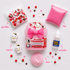 Strawberry Milkshake contents laid out: sprinkles, cow charms, pink clay, activator bottle and slime